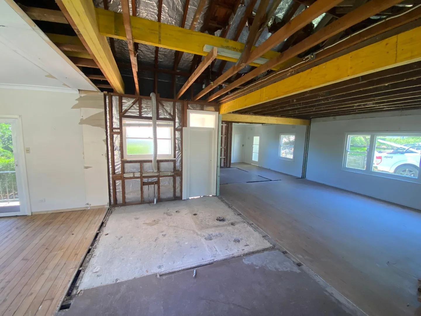 Interior stripped back to clean structure with new engineered beams installed across the ceiling